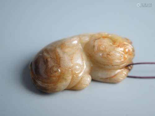 A Chinese Carved Greenish Jade Beast