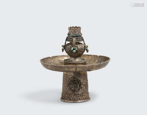 Tibet, 19th/20th century  A turquoise-inset silver alloy altar piece