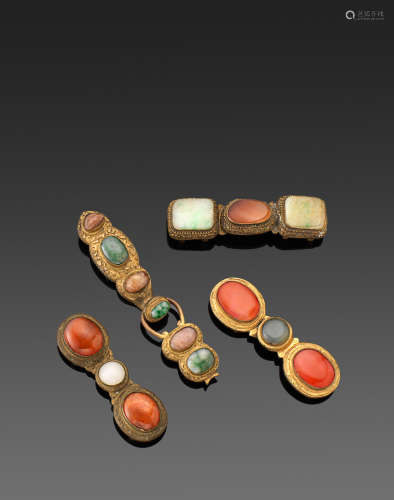 Qing dynasty A GROUP OF FOUR GILT-METAL HARDSTONE AND GLASS MOUNTED BELT BUCKLES