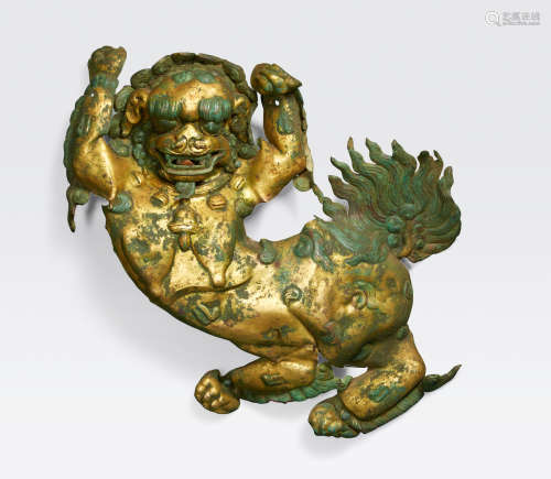 Tibet, 17th/18th century A gilt copper alloy repoussé plaque of a snow lion