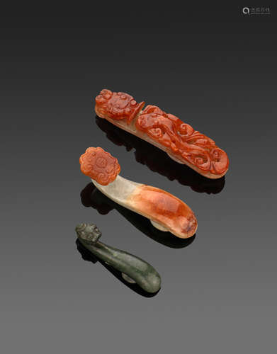 A group of three jade belt hooks