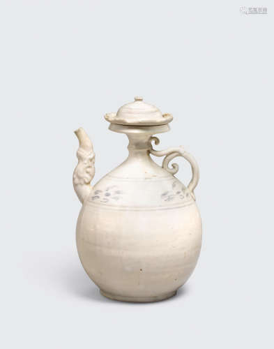 Tran dynasty, 13th/14th century A white glazed ewer and lid with underglaze iron decoration