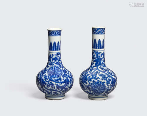 Kangxi period TWO BLUE AND WHITE 'LOTUS' STICK NECK VASES