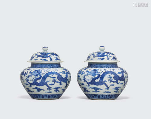 Jiajing marks, Late Qing dynasty A PAIR OF BLUE AND WHITE 'DRAGON' JARS AND COVERS