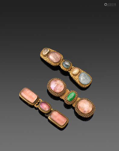 Qing dynasty A GROUP OF THREE GILT-METAL HARDSTONE MOUNTED BELT BUCKLES