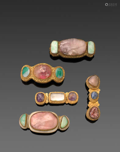 Qing dynasty A GROUP OF FIVE GILT-METAL HARDSTONE MOUNTED BELT BUCKLES