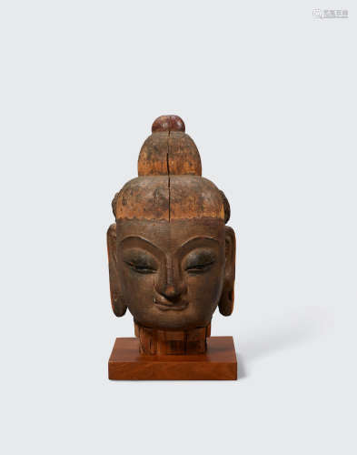 Yuan/early Ming dynasty A large carved and lacquered wood head of Buddha
