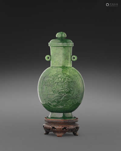 20th century A spinach jade vase and cover with dragon roundels