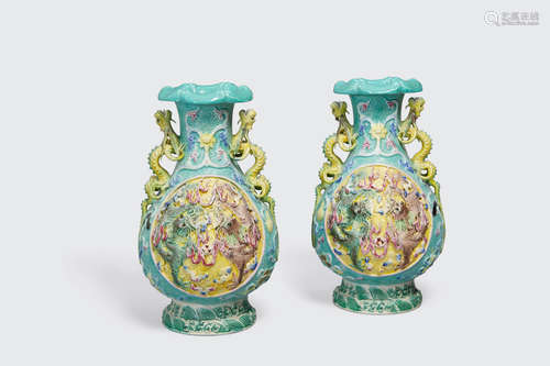 Qianlong marks, 20th century A pair of molded porcelain dragon vases