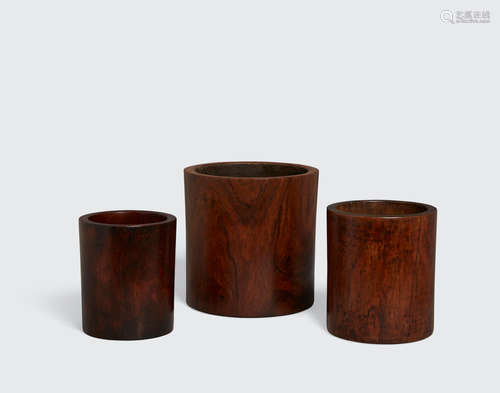 Two huanghuali and one hardwood cylindrical brush pots