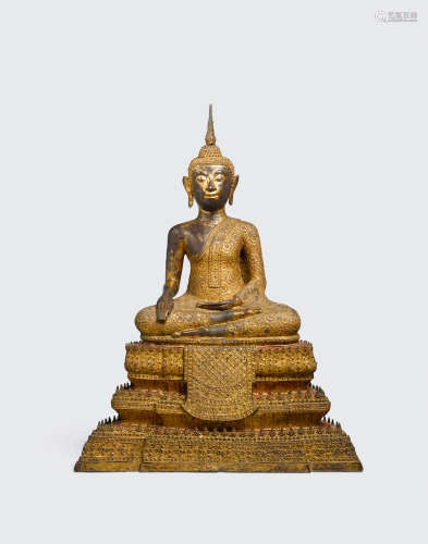 Thailand, Bangkok period, 19th/early 20th century A gilt and polychrome lacquered bronze figure of a seated Buddha