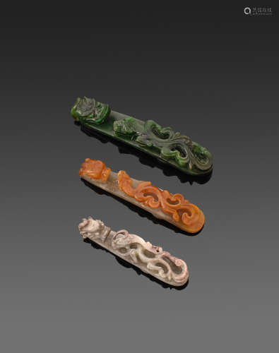 A group of three jade belt hooks