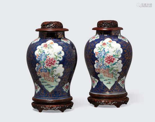 Late Qing/Republic period A pair of cobalt ground baluster jars with gilt and famille rose decoration