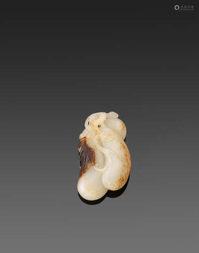 A carved jade pebble