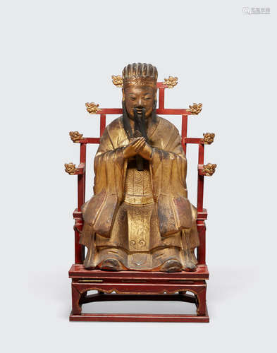 Late Qing dynasty A gilt and polychrome lacquered seated figure of a Daoist divinity