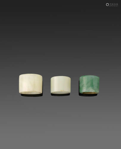 A group of three jade and hardstone archer's rings