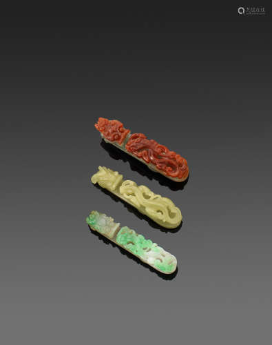 A group of three jadeite and serpentine belt hooks