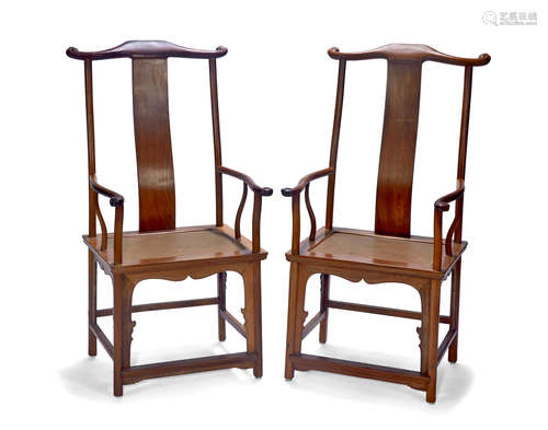 A pair of hardwood yolk-back arm chairs