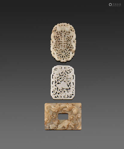 A group of three reticulated jade plaques