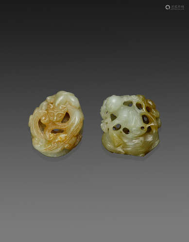 Two carved nephrite toggles