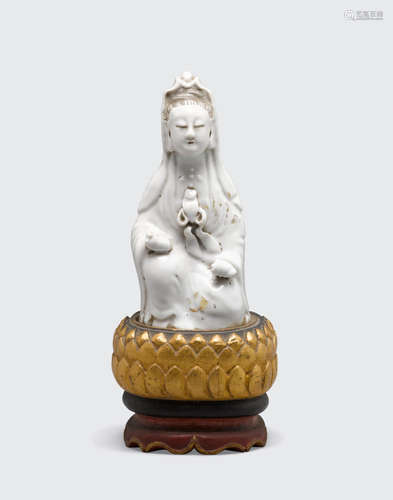 18th century A Dehua figure of Guanyin with traces of pigment