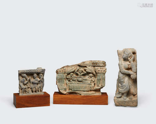 Ancient region of Gandhara, 2nd to 4th century A group of three grey schist relief panels