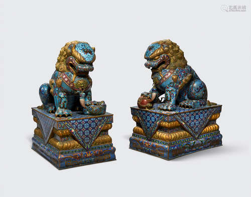 A pair of cloisonné enameled lions and stands