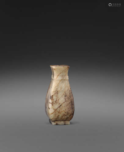 A  small carved jade vase