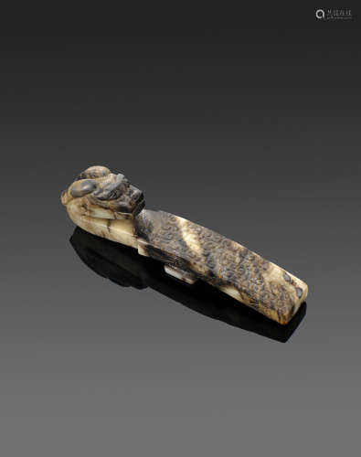 A carved jade belt buckle