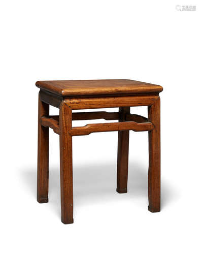 A mixed hardwood rectangular stool