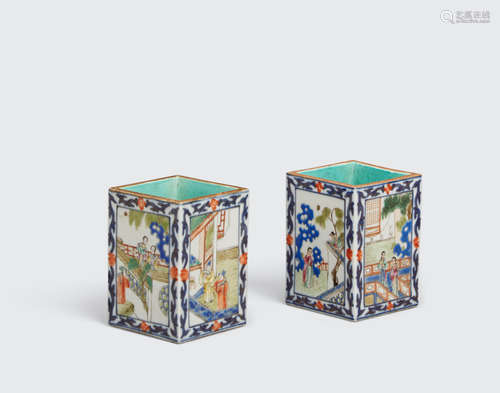 Qianlong marks, 19th century A pair of underglaze blue and famille rose enameled porcelain brush pots