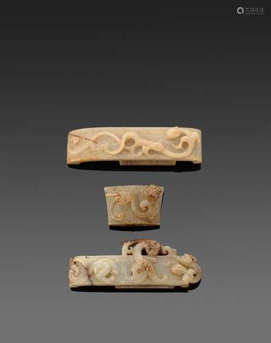 A group of three archaistic jade sword fittings