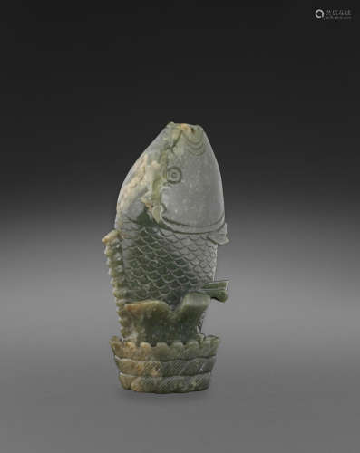 A green jade carving of a leaping carp