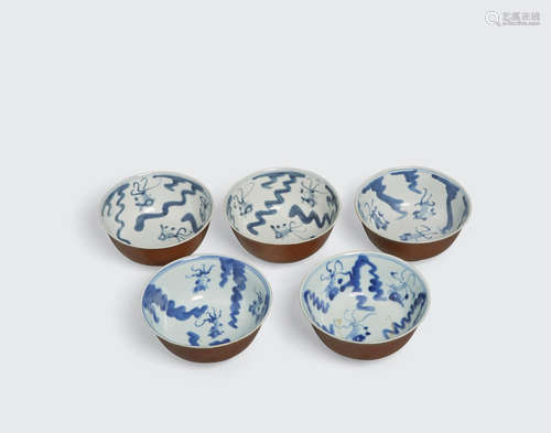 Qing dynasty A group of five brown glazed bowls with underglaze blue decoration