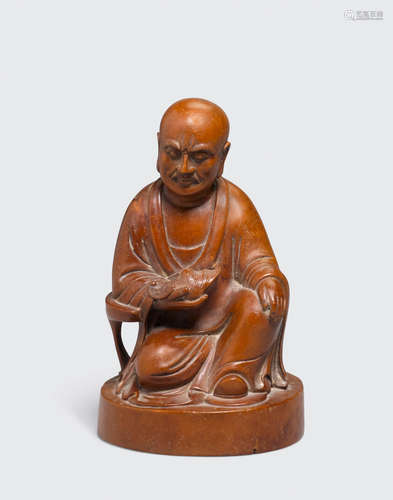 Qing dynasty A boxwood carving of a seated Luohan