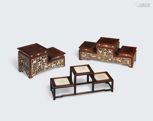 A group of three wood stands with inlaid decoration