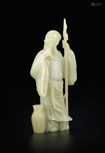 A carved jade figure of a fisherman