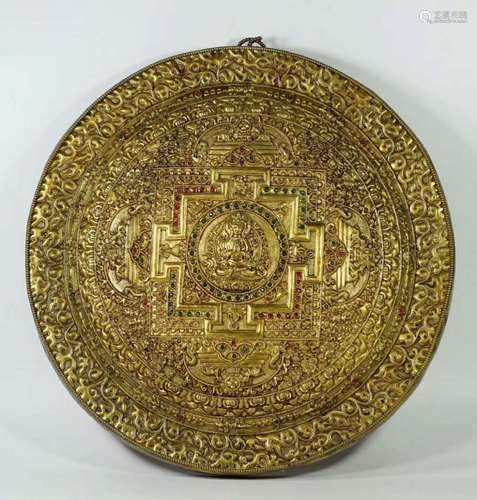 A Gilt Bronze Disk Depicting Buddha with Gemstone Inlay