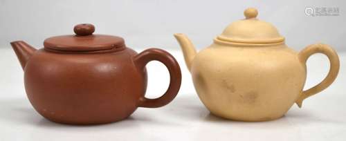 Two Qing Dynasty Yixing Teapots, one in Cream Clay