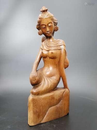 A Carved Huangyang Wood Lady