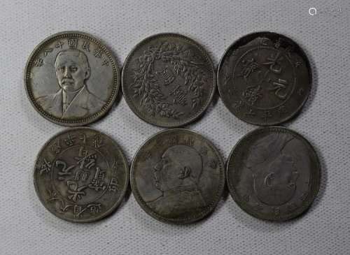 SIX CHINESE DOLLAR COINS