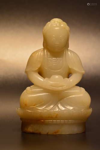 Carved white jade and russet of seated buddha