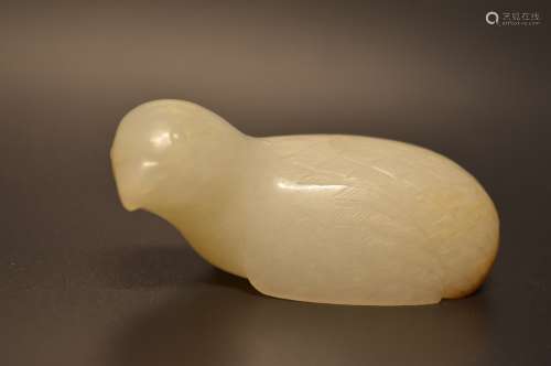 Carved white jade depicting child playing ball