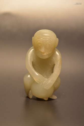 Carved white jade of a mythical monkey