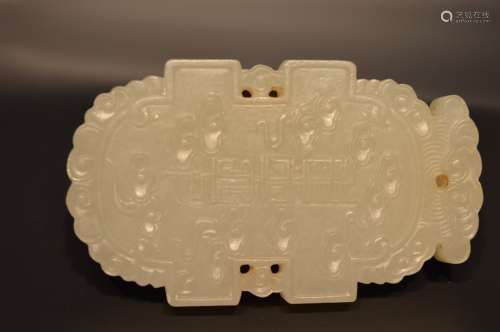 Finely carved dragon on white jade plaque