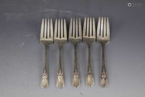 Five silver forks