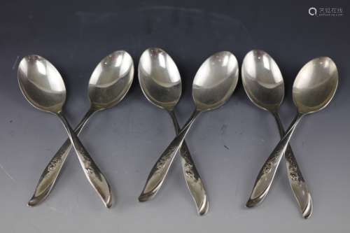 Six silver spoons