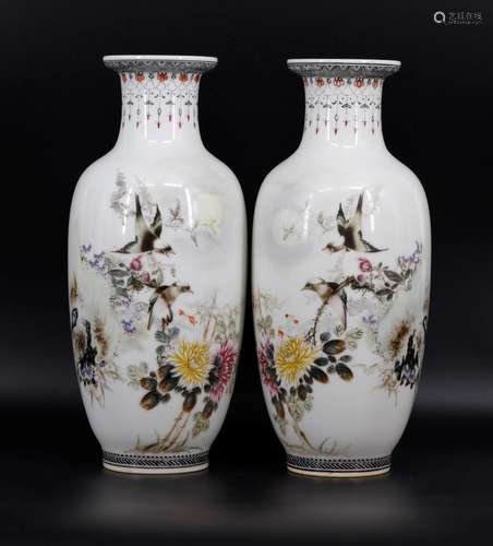 A pair of flower and bird rouleau vases