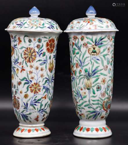 A pair of famille verte fluted beakers and covers