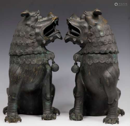 A pair of large brass lions